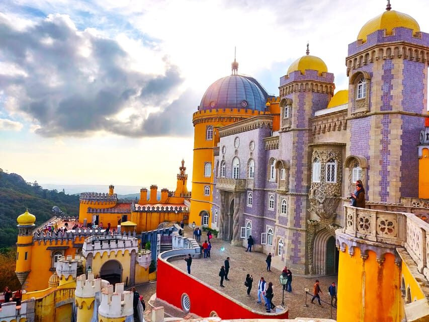 Lisbon: Half-Day Sintra Tour with Pena Palace and Regaleira - Quinta da Regaleira: UNESCO symbols, grottoes, and guided walking