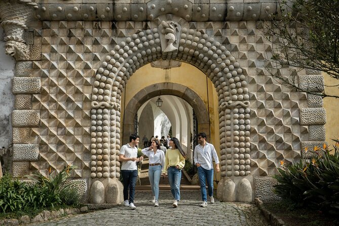 Sintra: Pena Palace & Cabo da Roca Hike from Lisbon - Praia da Adraga: rocks, caves, and a dramatic end point